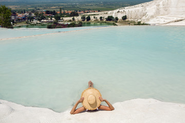 Poster - sexy young woman lie in a swimsuit at the white limestone mountain