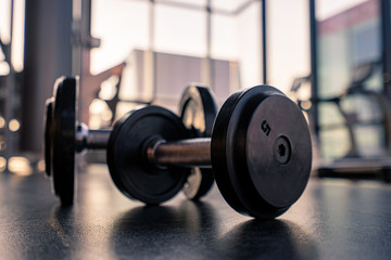 Dumbbell on the floor in luxury clubhouse wait for exercise in the morning