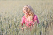 © Jari Sokka - Beautiful blonde woman hugging the wheat