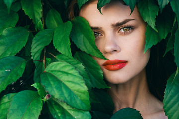 beautiful woman green leaves nature park