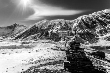 Wall Mural - Stone stupa with prayer flags near Tilicho lake. Nepal, Himalaya mountains, Annapurna Conservation Area