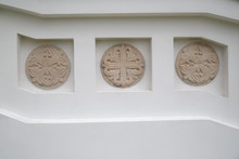 Round Decorative Bas-relief On A White Wall.