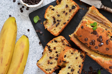 Wall Mural - Banana cake with chocolate drops on the kitchen table. Classic dessert.