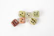 © Nikolay - Dices made of natural stone on a white background. Copy space. Gaming.