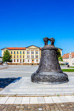 Bell Monument At Alba Carolina Citadel, Alba Iulia, Transylvania, Romania, Universitatea 1 Decembrie 1918 In The Background