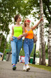 © Andrey_Arkusha - Two girlfriends walking on summer park, outdoors