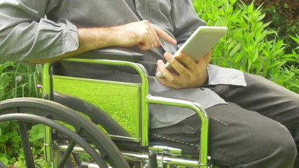 man using touchpad device in a wheelchair 2