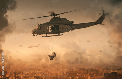 Fotografía Military helicopter and forces with dog in destroyed city and soldiers are in fl