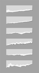 Wall Mural - Torn sheets of paper. A set of torn paper and strips of paper on a dark background. Vector illustration.