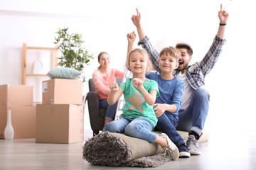 Poster - Father playing with children indoors. Happy family on moving day