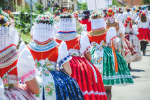 Young Women During Parade In Traditional Czech Folklore Costumes. Photographed In Southern Moravia, Czechia. Moravian Motifs. Festive, Tradition