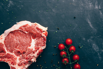 top view of piece of raw meat on dark background