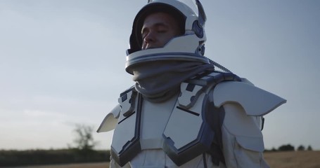 Wall Mural - Astronaut opening helmet on Mars