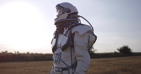 Wall Mural - Astronaut opening helmet on Mars