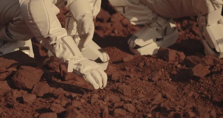 Wall Mural - Astronauts collecting rock samples on Mars