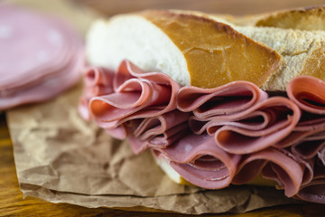 Wall Mural - Sandwich with bologna bread. Snack typical of Brazil. Homemade bread snack with bologna. Fast food.