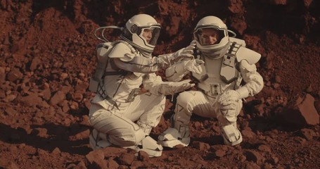 Wall Mural - Astronauts collecting rock samples on Mars