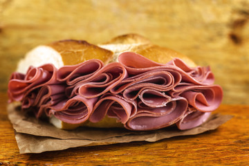 Wall Mural - bread with mortadella typical of Brazil. Bakery snack. Snack made at the municipal market of the city of São Paulo.