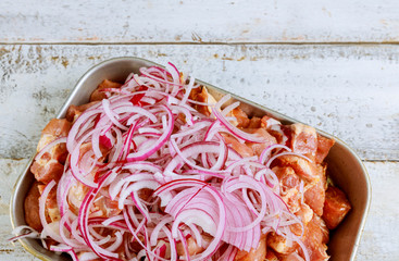 Wall Mural - Cutted meat pieces with onion in tray