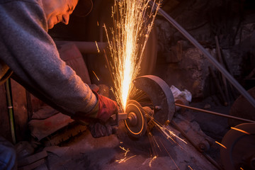 Wall Mural - the blacksmith polishing metal products