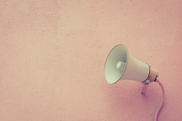 Old loud speaker on the cement wall