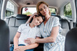 © LIGHTFIELD STUDIOS - selective focus of mother and son with closed eyes in car