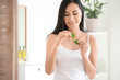 © Pixel-Shot - Beautiful Asian woman using aloe vera at home