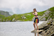 © Xalanx - Woman kickbox fighter training by the lake