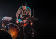 © puhimec - musician playing drums, black background and beautiful soft light