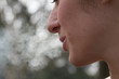 © Alessandro Grandini - A close up view on the mouth of a young woman smoking a cigarette. Blowing used smoke from mouth after inhaling addictive and toxic substance.