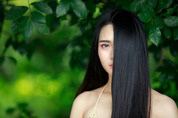 Portrait of Beautiful woman face, Asian woman, beautiful, sexy, long hair with natural background, beautiful model girl with long shiny hair