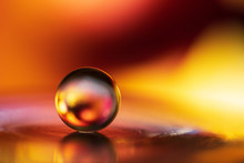 Small Glass Ball In Abstract Macro Composition.