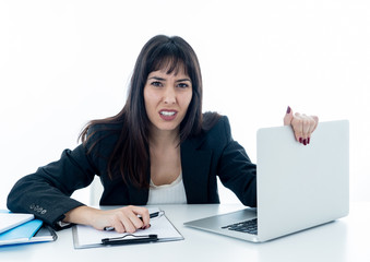 Young business woman stressed and desperate with laptop. Frustra