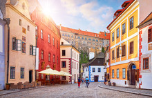 Cesky Krumlov, Czech Republic. Ancient Street With Old Houses. Evening Sunset With Sunlight.