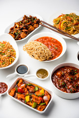 Wall Mural - Assorted Indo chinese dishes in group includes Schezwan/Szechuan hakka noodles, veg fried rice, veg manchurian, american chop suey, chilli paneer, crispy vegetable and vegetable soup