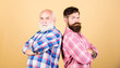 relatives. two bearded men senior and mature. youth vs old age compare. retirement. barbershop and hairdresser salon. father and son family. generational conflict. male beard care. checkered fashion
