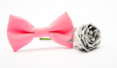 silver rose flower and male bow tie isolated on white. Wedding accessories. Elegant look. Esthete detail. Modern formal style. Fashion accessory. vintage and retro style. Groom wedding