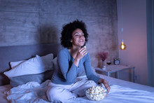 Woman Watching A Funny Movie On TV