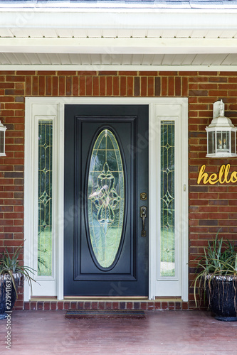 Black Front Door Of Traditional Red Brick Home Buy This Stock