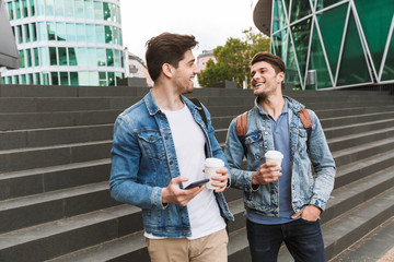 Poster - Two smiling young men friends dressed casually