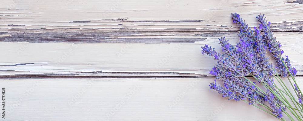 Summertime - lavender flowers. Bunch of lavender flowers on white rustic wooden background. - obrazy, fototapety, plakaty 