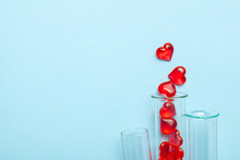 Hearts And Test Tube. Baby From Tube Vitro Glass. Artificial Insemination, IVF. Blue Background. Copy Space For Text.