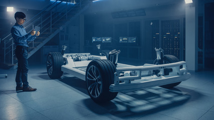 Poster - Automobile Engineer Working on Electric Car Chassis Platform, Using Tablet Computer Augmented Reality with 3D CAD Software Modelling. Innovative Facility: Vehicle Frame with Wheels, Engine, Battery