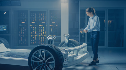 Poster - Automobile Engineer Working on Electric Car Chassis Platform, Using Tablet Computer Augmented Reality with 3D CAD Software Modelling. Innovative Facility: Vehicle Frame with Wheels, Engine, Battery
