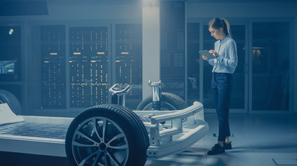 Poster - Automobile Engineer Working on Electric Car Chassis Platform, Using Tablet Computer Augmented Reality with 3D CAD Software Modelling. Innovative Facility: Vehicle Frame with Wheels, Engine, Battery