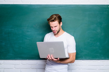 Wall Mural - Student learn programming language. School teacher programming with laptop. Handsome man use modern technology. Digital technology. Apply online course for programmers. Programming web development