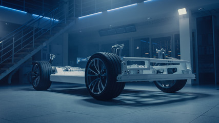 Leinwandbilder - Concept of Authentic Electric Car Platform Chassis Prototype Standing in Industrial Machinery Design Laboratory. Hybrid Axel Frame include Wheels, Suspension, Engine, Brakes and Battery. 