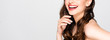 cropped view of beautiful nude brunette woman with curls and makeup laughing isolated on grey