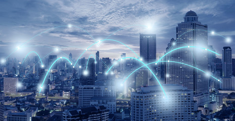 technology connectivity busy in the city in blue tone.