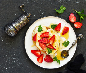 Wall Mural - toast with grilled mozzarella, fresh strawberries and honey. Useful zavstrak.